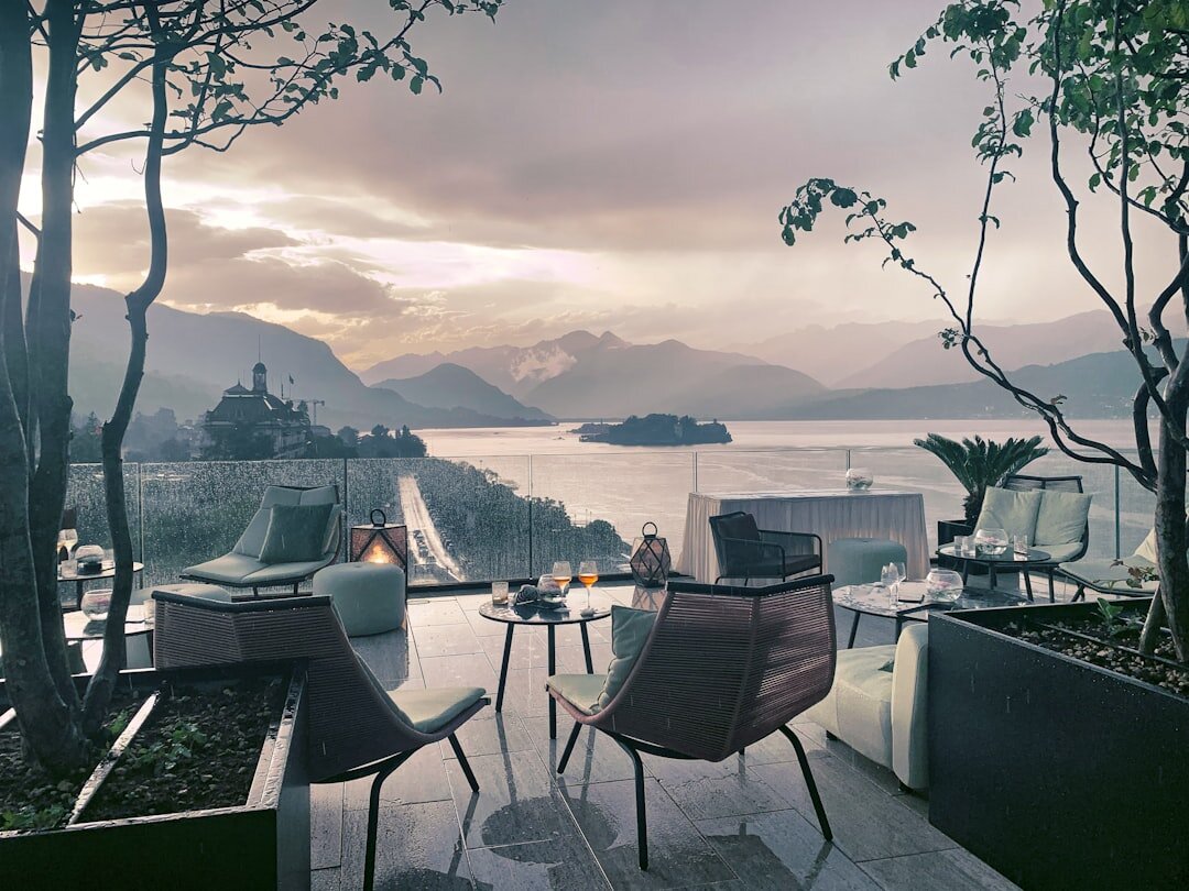 Trendy rooftop bar overlooking a lake at dusk